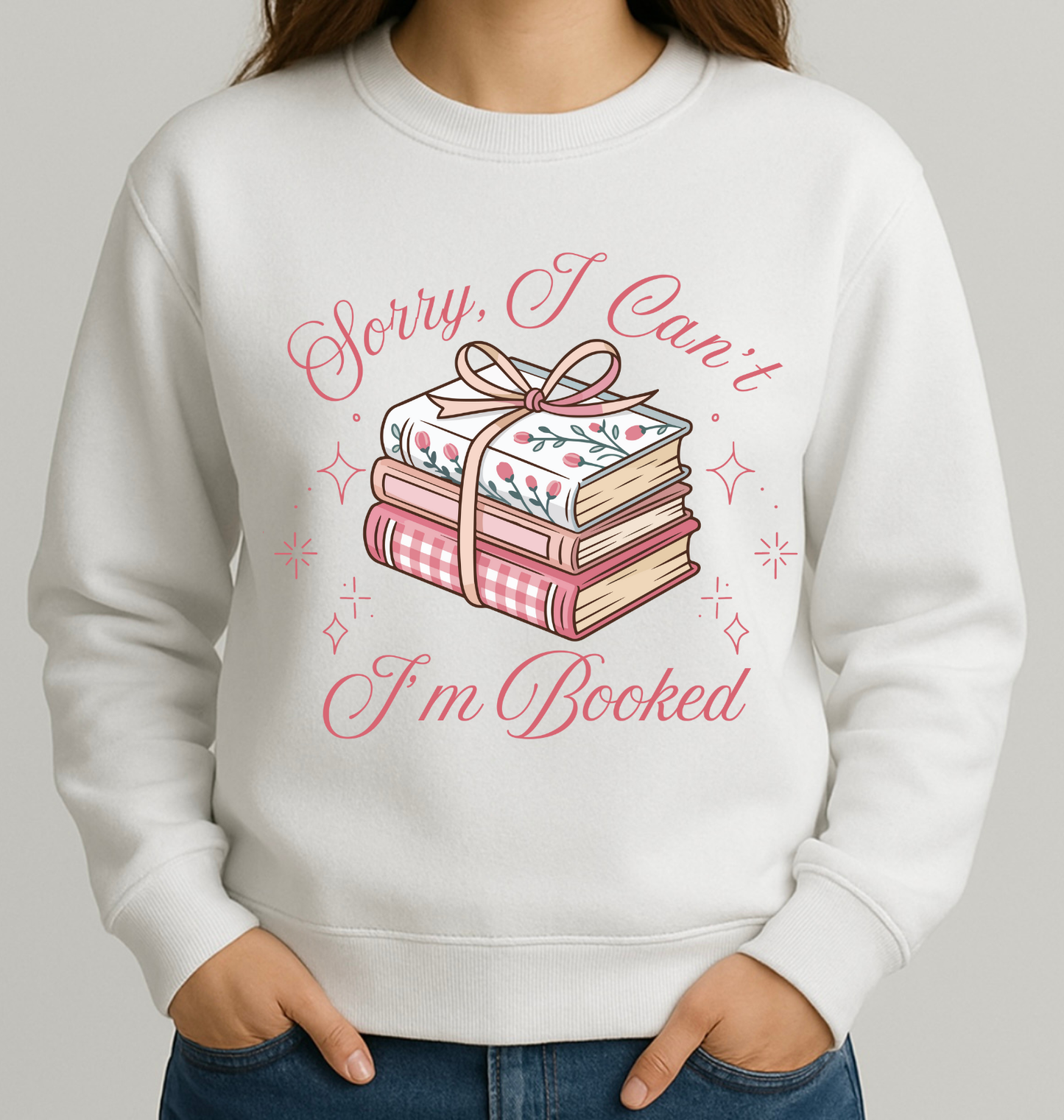 White sweatshirt with book-themed design and text on a plain background